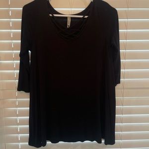 black mid sleeve with cross over detailing on chest